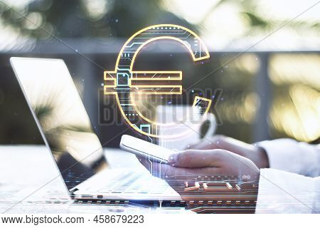 Close Up Of Businessman Hands Using Laptop Keyboard And Smartphone On Desktop With Creative Glowing 