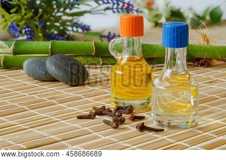 Clove And Lavender Oils. Essential Oils In Bottles