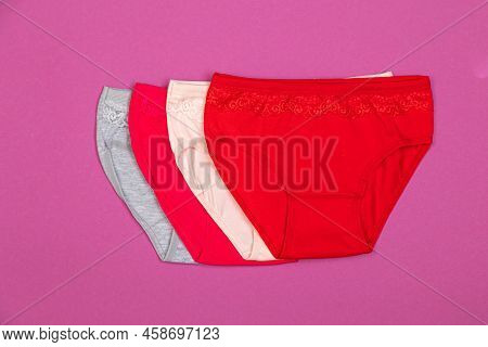 Clothes For Children In The Form Of Panties On A Pink Background. Clothes For Children From Soft Fab