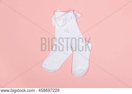 High White Children's Socks For Girls With Big Bows For Party Wear On A Pink Background