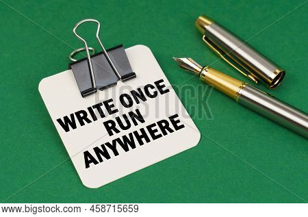 Business And Industry Concept. On A Green Surface, A Pen And A Sheet Of Paper With The Inscription -