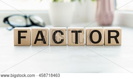 Text Factor Written On Wooden Cubes. Risk Factors. Evaluation Of Sales Factors. High Quality Photo.