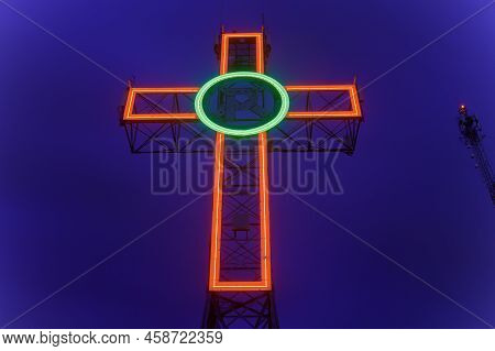 Mont-bellevue Sherbrooke Canada Peace Cross Monument Illuminated At Night Red And Green Neon On Blue