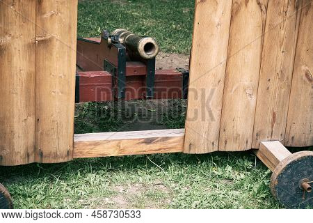 Vintage Swedish Cannons And Metal Cannonballs. Ancient Military Arsenal Of The Events Of The Russian