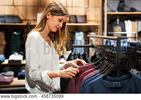 Portrait Of Happy Beautiful Woman Shopping In Boutiqe. People Consumerism Happiness Concept.