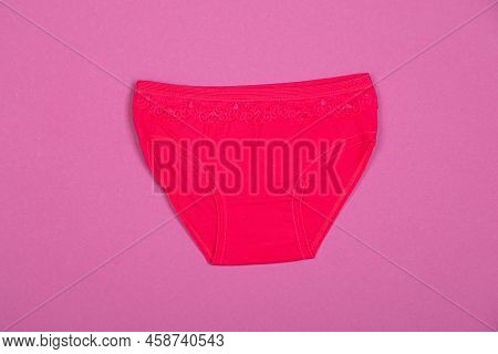 Clothes For Children In The Form Of Panties On A Pink Background. Clothes For Children From Soft Fab