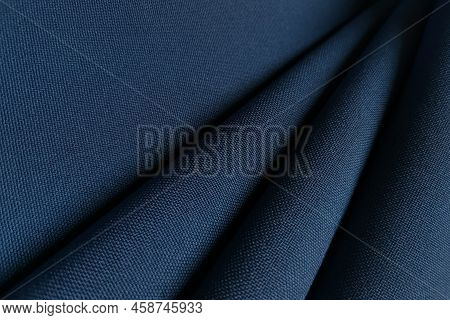Blue Crumpled Or Wavy Fabric Texture Background. Abstract Linen Cloth Soft Waves. Gabardine Wool Fab