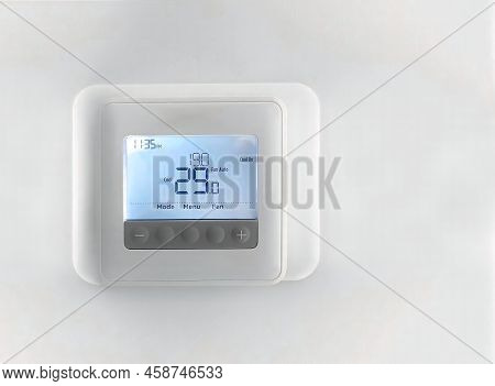 A Programmable Thermostat On A Wall That Manage  Home Heating And Cooling