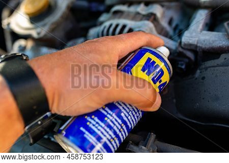 Miercurea Ciuc, Romania- 26 July 2022: Mechanic Using Wd-40 Multi Purpose Oil To Loosen A Tight Bolt