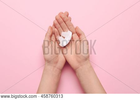 Woman Holding Anti-snoring Device For Nose On Pink Background, Top View