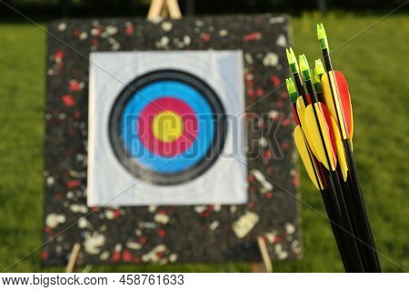 Many Arrows Against Near Target Outdoors, Closeup. Space For Text