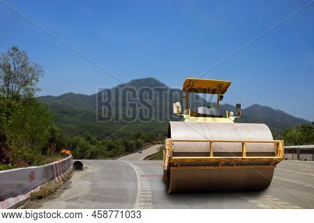 Roller Rolling Fresh Hot Asphalt On The New Road. Road Construction. The Road Rollers Working On The