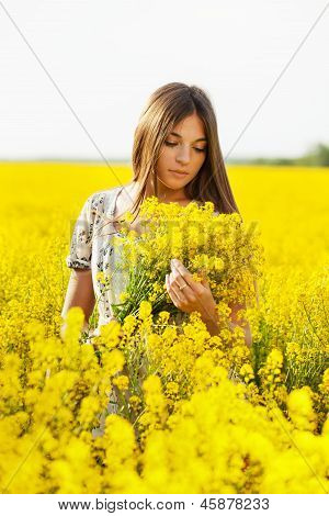 Girl Holding A Bouquet Of Yellow Flowers