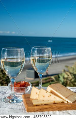Spanish Hard Andalusian Cheese Filled With Sweet Sherry Served Outdoor With Membrillo Jam With Two G