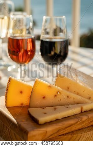 Spanish Hard Andalusian Cheese Filled With Pedro Ximenez Sweet Sherry Served Outdoor With Two Glasse