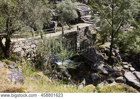Waterfall And Rocks Of The Fafiao River, In The Gerês Natural Park (portugal)