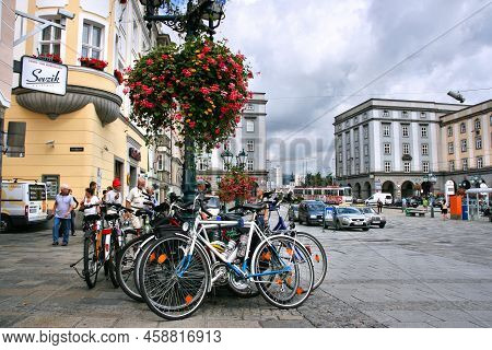 Linz, Austria - August 5, 2008: People Visit The Main Square Hauptplatz In Linz, Austria. It Is The 