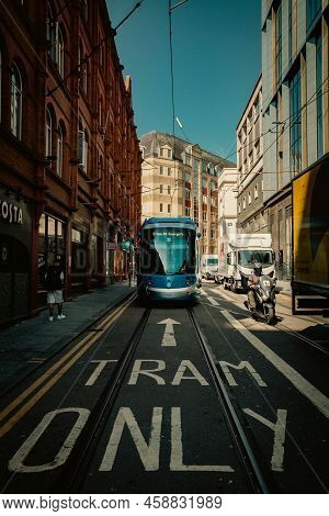 Birmingham, Uk - July 18, 2022.  A West Midlands Metro Tram Travelling Along Tracks On The City Stre
