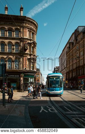 Birmingham, Uk - July 18, 2022.  A West Midlands Metro Tram Travelling Along Tracks On The City Stre