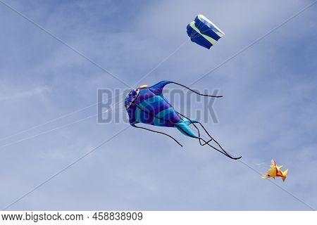 Fish-like Kite Flying In Mid-air During The Wind And Kite Festival In Porspoder, Brittany.