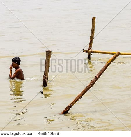 Garh Mukteshwar, Uttar Pradesh, India - June 11 2022 - People Are Taking Holy Dip On The Occasion Of