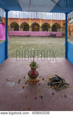 Howrah, India -october 26th, 2020 : Sacred Mangal Ghot Worshipped With Green Coconut On It, At Far G