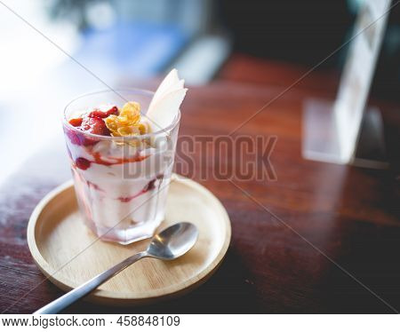 Picture Of A Homemade Fruit Yoghurt With Strawberry Jam, Apple And Conflake