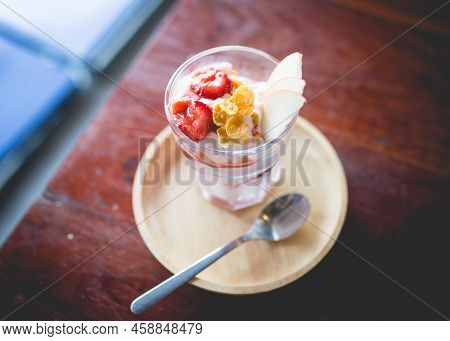 Picture Of A Homemade Fruit Yoghurt With Strawberry Jam, Apple And Conflake