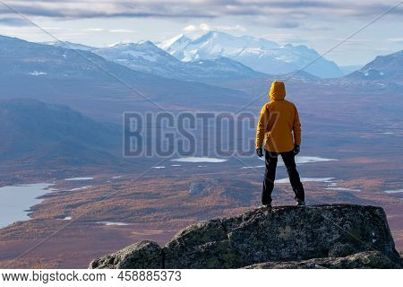 Male Hiker Overlooking Epic View Of Vast Arctic Landscape Of Stora Sjofallet National Park, Sweden, 