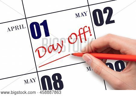 1st Day Of May. Hand Writing Text Day Off And Drawing A Line On Calendar Date 1 May. Vacation Planni