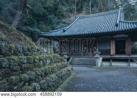 Kyoto, Japan - 12.09.2017: Evening Near Historic Buddhist Temple. Hundreds Of Stone Statues In The G
