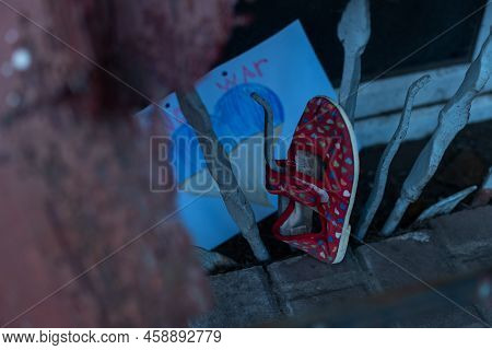 Childrens Shoes And The Flag Of Ukraine, The Warthe War In Ukraine.