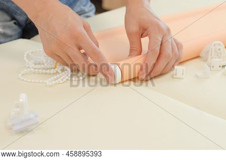 Assembly Of Roller Blinds. Women's Hands Are Assembling Roller Blinds, Close-up.