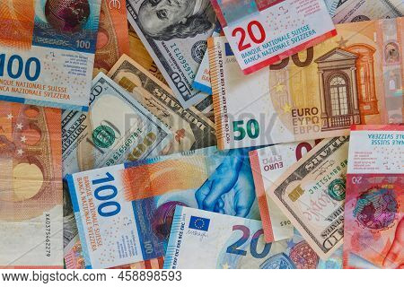 Multicurrency Background Of Us Dollars, Euros And Swiss Francs
