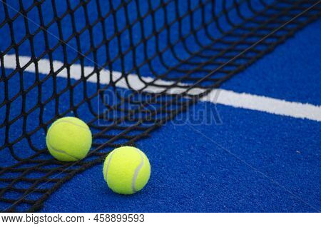 Blue Paddle Tennis Court, Two Balls Near The Net