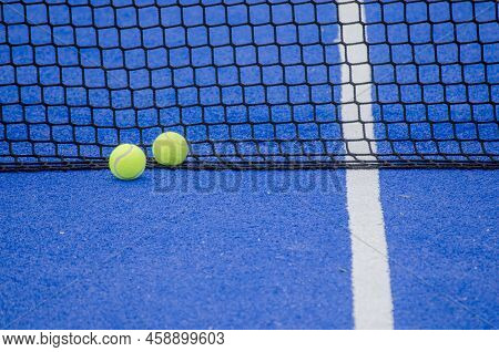 A Ball On A Paddle Court, Behind The Net.