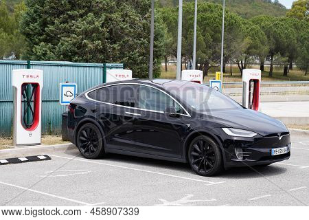 Bordeaux , Aquitaine  France - 07 25 2022 : Tesla Model X Ev Electric Car Vehicle In Charging Statio