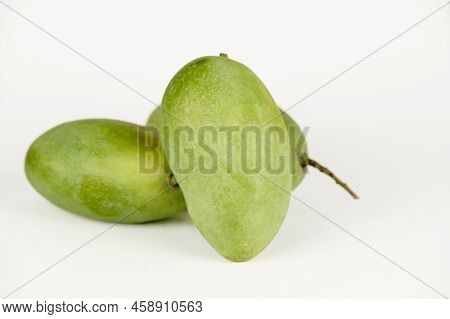 Closeup View Of Three Langda Mangoes (magnifera Indica) On A White Background
