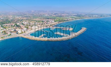 Aerial Bird's Eye View Of Zygi Fishing Village Port, Larnaca, Cyprus. The Fish Boats Moored In The H