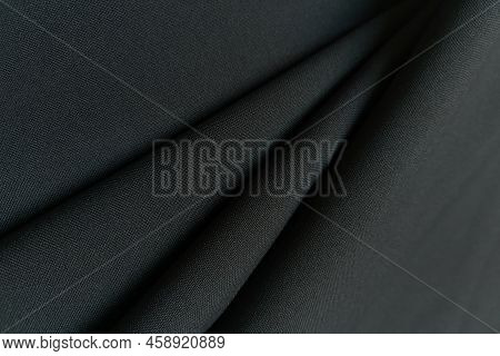 Gray Crumpled Or Wavy Fabric Texture Background. Abstract Linen Cloth Soft Waves. Gabardine Wool Fab