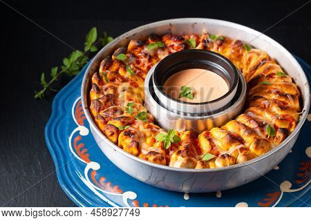 Food For Party Concept Organic Homemade Pull Apart Pizza Ring On Black Background With Copy Space