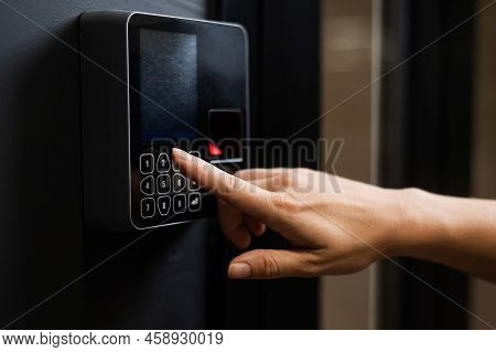 The Woman Enters The Code And Opens The Door. Modern Keyless Entry Lock.