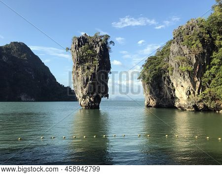 Thailand, An Island In The Ocean. In The Photo Is The Ocean, In The Middle Of The Photo Is A Rock In