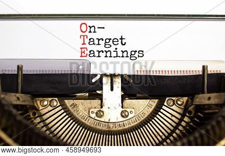 Ote On-target Earnings Symbol. Concept Words Ote On-target Earnings Typed On Old Retro Typewriter On