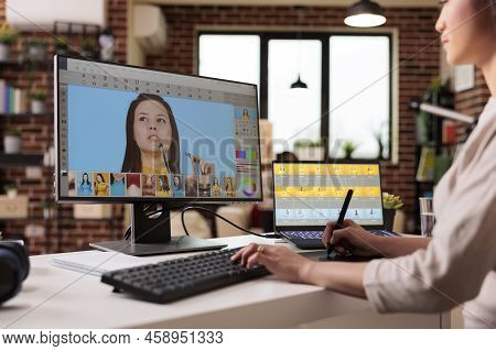 Asian Photographer Editing Picture With Retouching Software On Computer. Working With Retoucher Inte