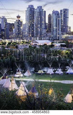 Calgary Alberta Canada, July 14 2022: Indigenous tipi's on display in the Indian Village sit in a ci