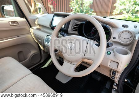Novosibirsk, Russia -  July 29, 2022:   Honda N-box,  Car Interior - Steering Wheel, Shift Lever And