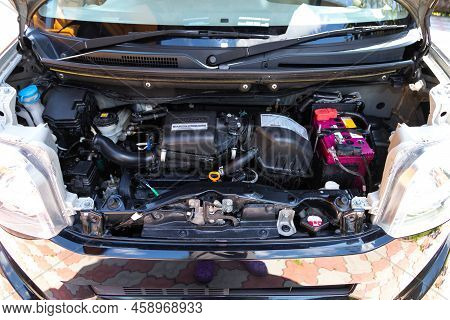 Novosibirsk, Russia -  July 29, 2022:   Honda N-box, Under The Hood Of Car. Powerful Engine Closeup.