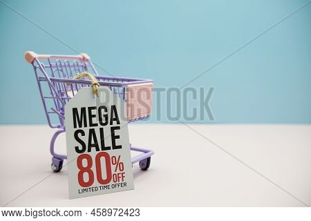 Mega Sale 80% Off Text Message On Price Tax With Shoppint Trolley Cart On Blue And Pink Background