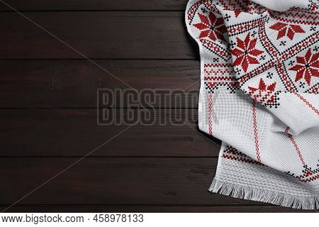 Beautiful Rushnyk On Wooden Table, Top View With Space For Text. Ukrainian National Embroidery